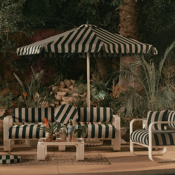 Green and cream striped lounge furniture by Business & Pleasure Co.